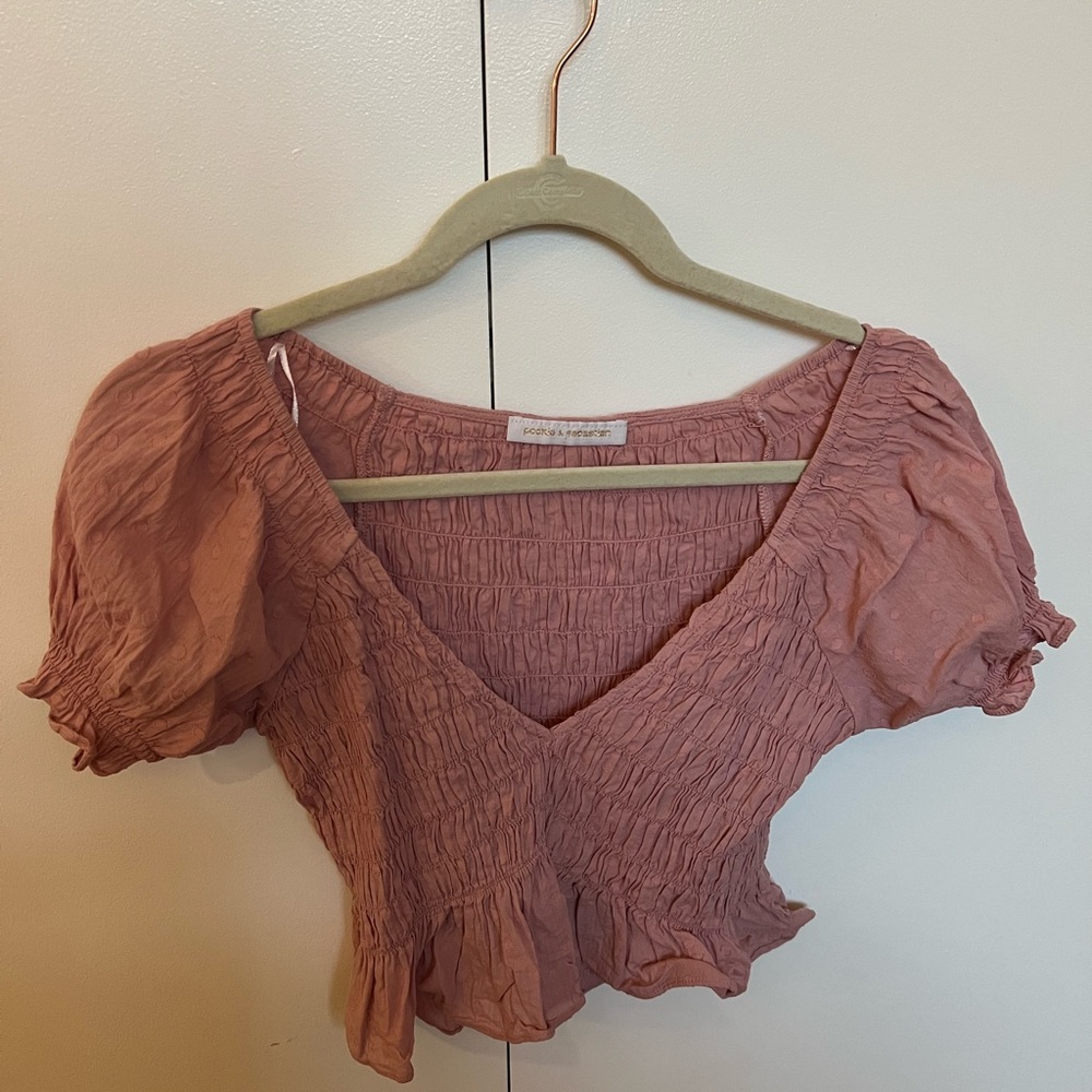 Extremely flattering pink top.